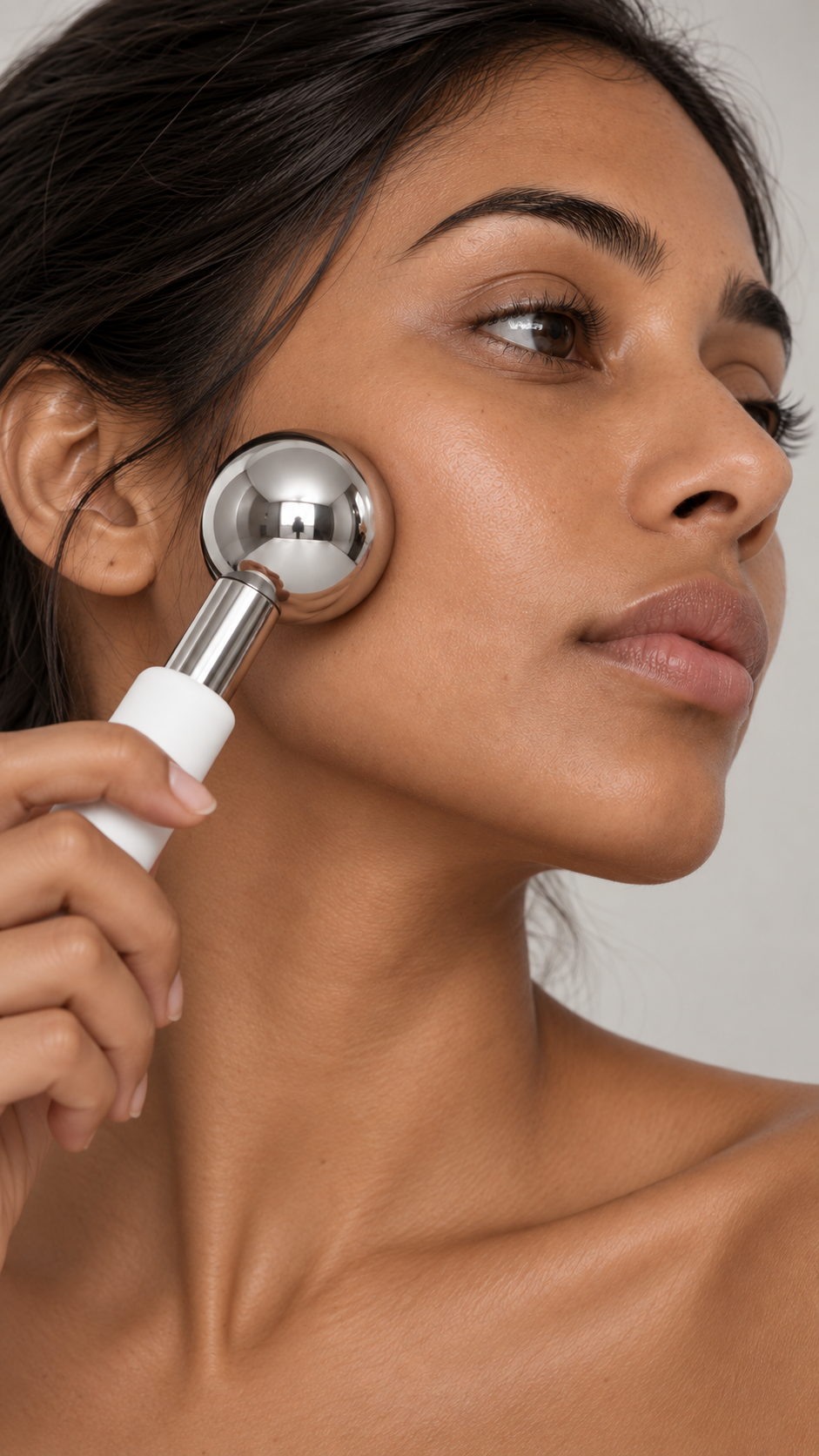 CRYVA Cryo Spheres in use during a facial massage